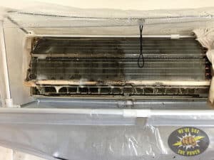 An air conditioning unit being cleaned. You can see the difference.